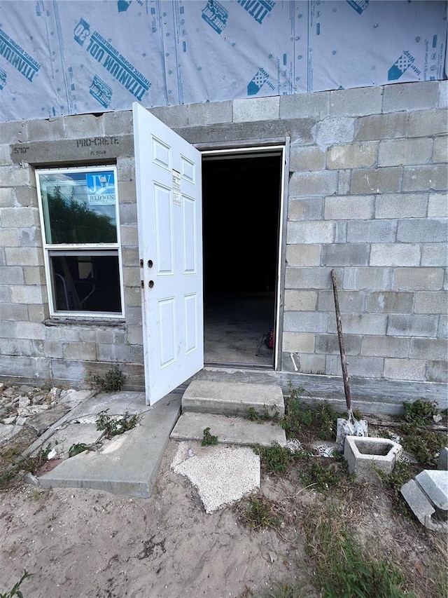 entrance to property featuring stone siding