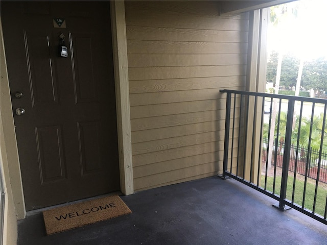 entrance to property featuring a balcony