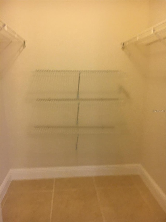 walk in closet featuring tile patterned floors