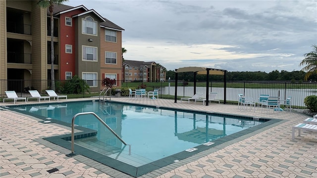 view of swimming pool with a patio area