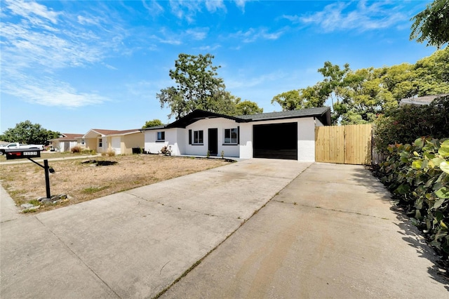 ranch-style house featuring a garage