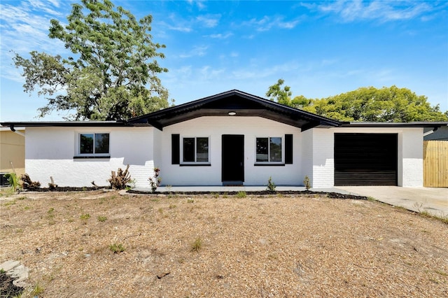 ranch-style home featuring a garage