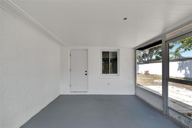 unfurnished sunroom featuring a wealth of natural light