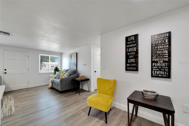 sitting room featuring hardwood / wood-style flooring