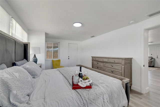 bedroom with light wood-type flooring