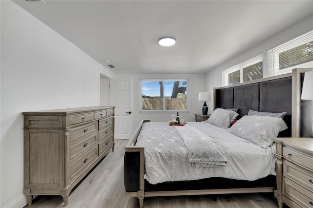 bedroom with light hardwood / wood-style flooring