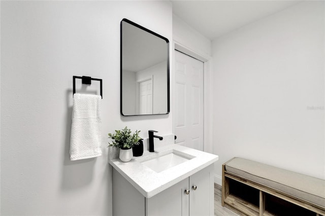 bathroom with vanity and hardwood / wood-style flooring