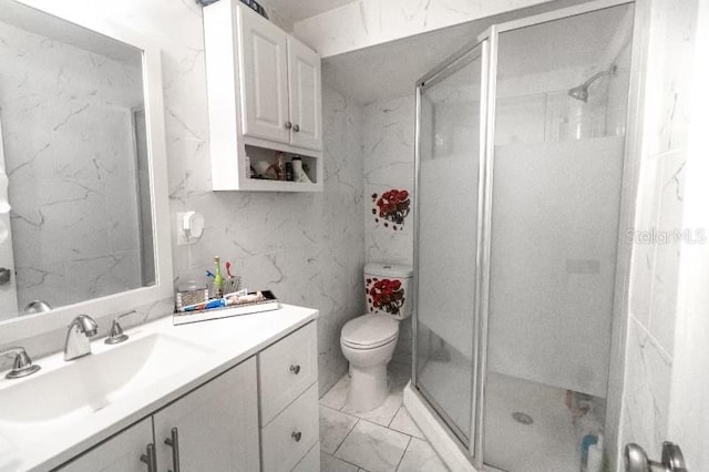 bathroom with toilet, an enclosed shower, and vanity