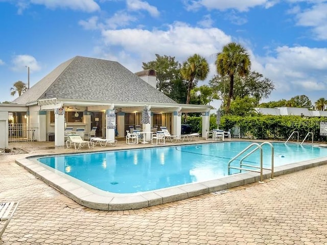 view of swimming pool with a patio