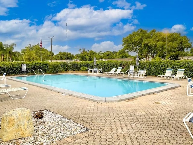 view of swimming pool with a patio area