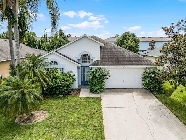 ranch-style house with a garage and a front yard