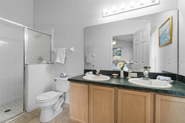 bathroom with vanity, toilet, walk in shower, and tile patterned flooring