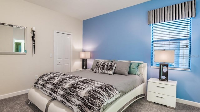 carpeted bedroom with a closet