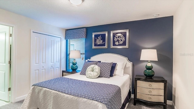 carpeted bedroom featuring a closet