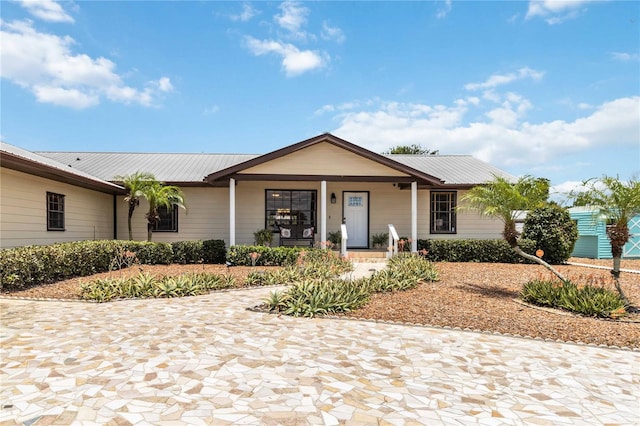 ranch-style house featuring a porch