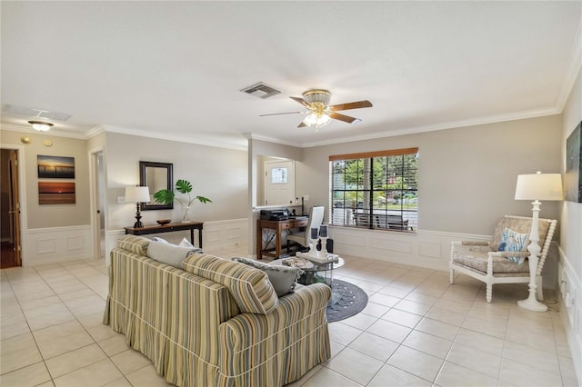 tiled living room featuring ceiling fan and ornamental molding