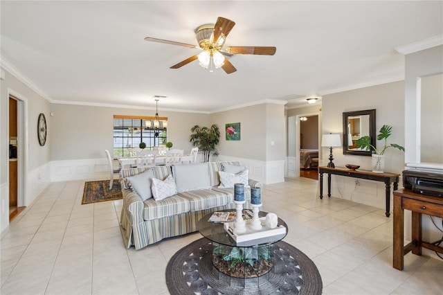 living room featuring ceiling fan, crown molding, and light tile patterned flooring