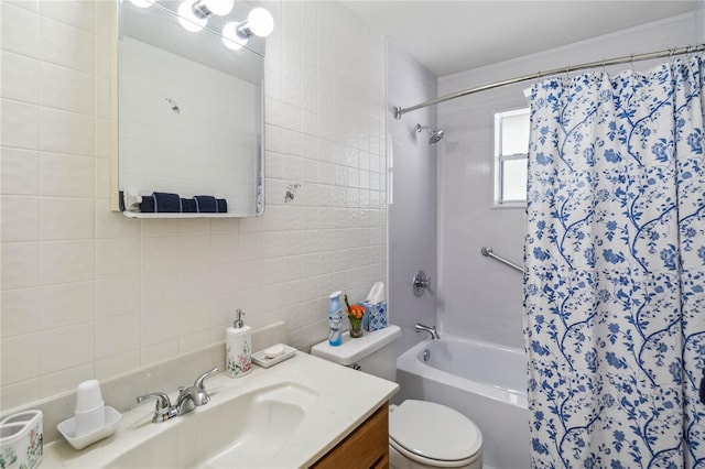 full bathroom featuring vanity, tile walls, toilet, and shower / bathtub combination with curtain