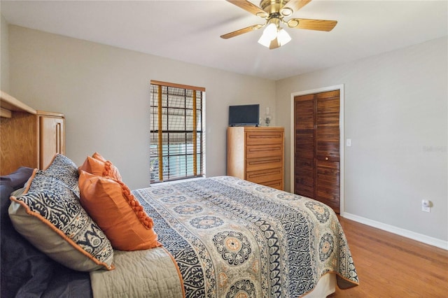 bedroom featuring a closet, ceiling fan, and hardwood / wood-style flooring