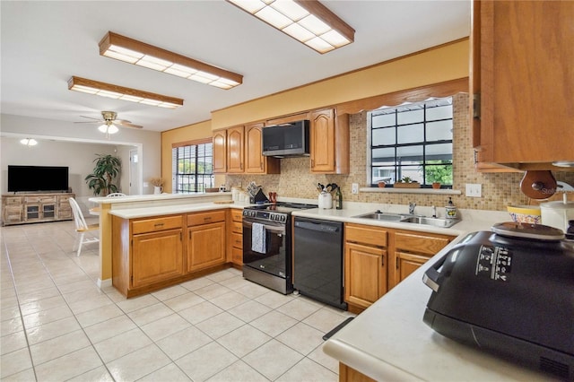 kitchen with black appliances, ceiling fan, sink, and light tile patterned floors