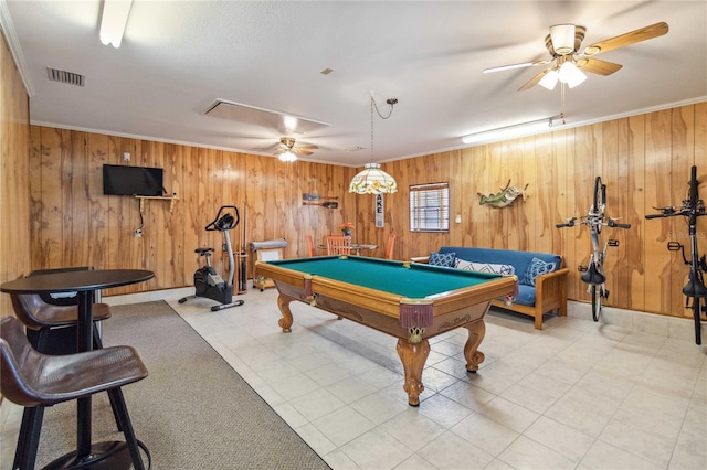 recreation room with ornamental molding, wood walls, ceiling fan, and pool table