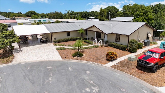 single story home featuring central AC unit