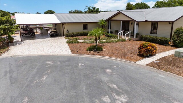 single story home with a carport