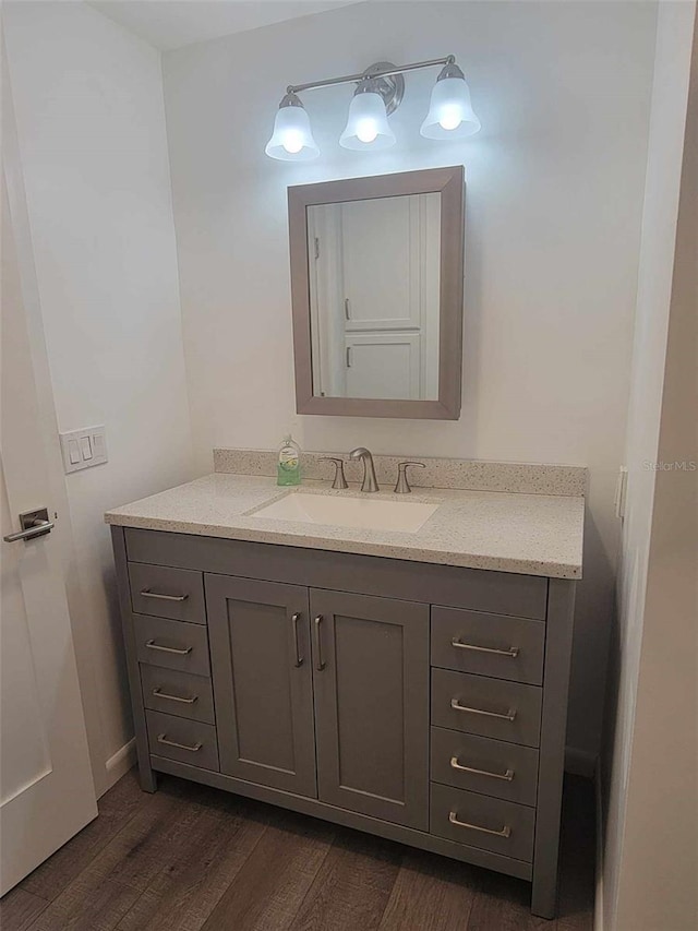 bathroom featuring vanity and hardwood / wood-style flooring