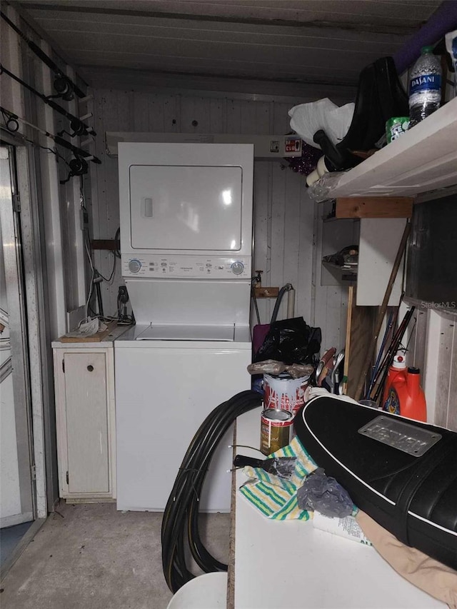 washroom with stacked washer and clothes dryer