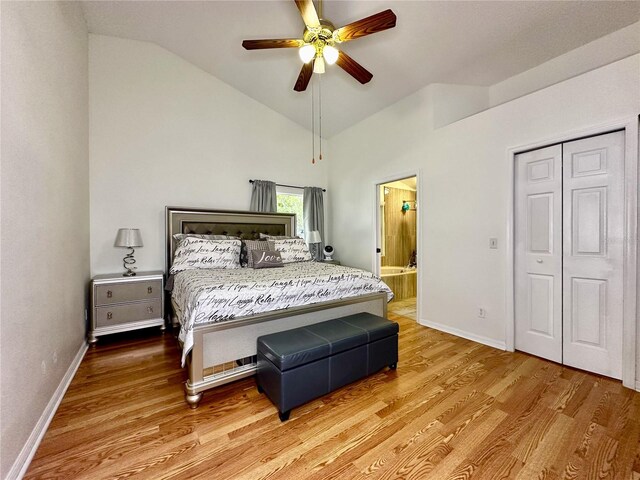 bedroom featuring lofted ceiling, a closet, wood-type flooring, and ceiling fan