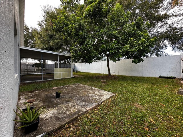 view of yard featuring a sunroom