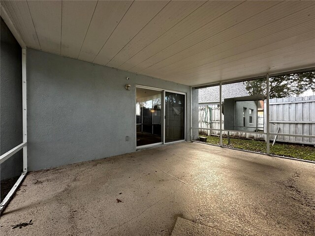 unfurnished sunroom featuring wood ceiling