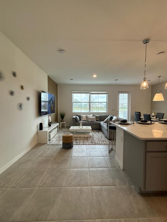 718 Longboat Dr, Davenport, FL 33896 - living area with healthy amount of natural light, a desk, baseboards, light tile patterned floors, and recessed lighting