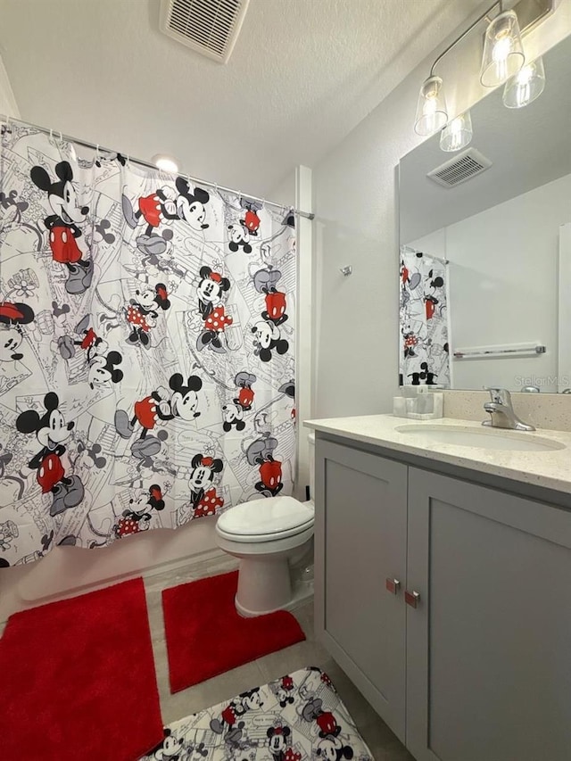 718 Longboat Dr, Davenport, FL 33896 - full bathroom with toilet, vanity, a shower with curtain, and tile patterned floors
