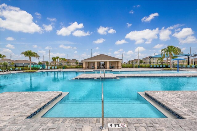 view of swimming pool with a patio area