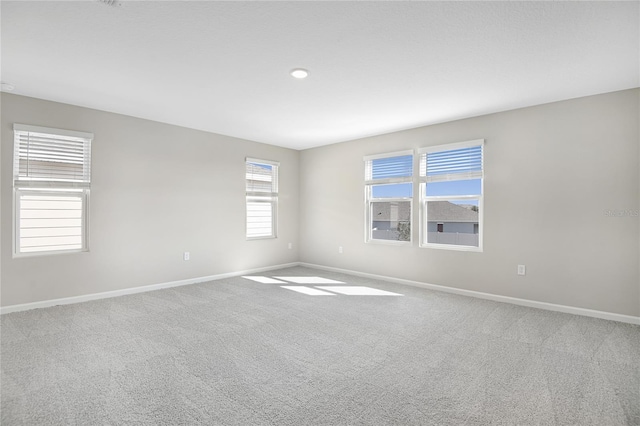 spare room featuring carpet flooring