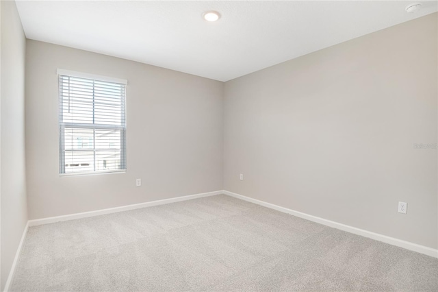 empty room with light colored carpet