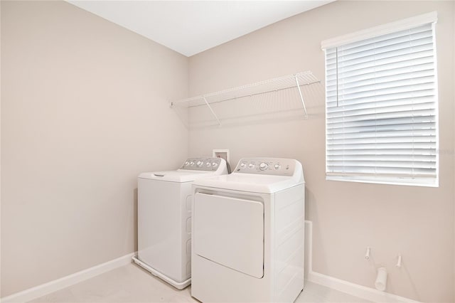 laundry room with washer and clothes dryer