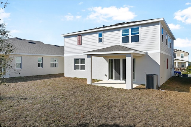 back of house featuring a patio area and central air condition unit