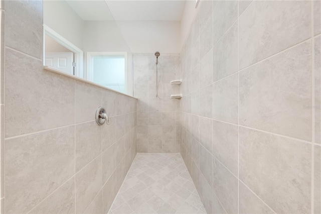 bathroom with tiled shower