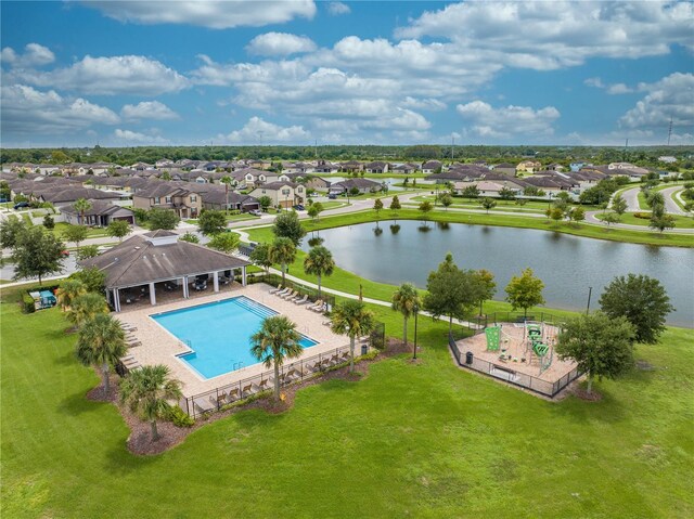 birds eye view of property with a water view