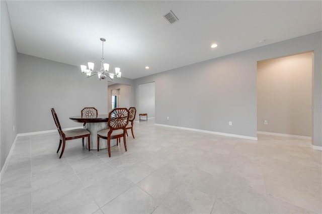 dining space with an inviting chandelier