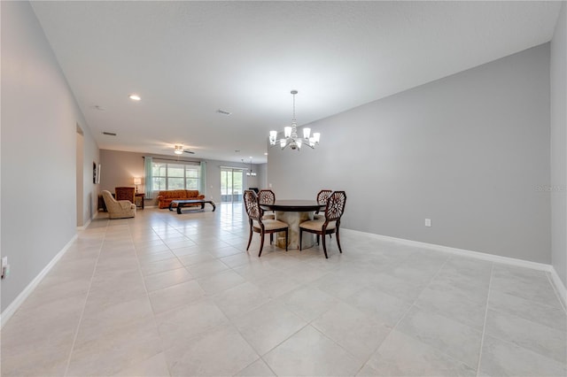 dining room featuring light tile patterned flooring and a chandelier