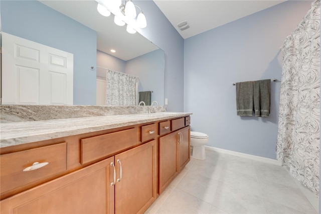 bathroom featuring tile patterned flooring, vanity, toilet, and a notable chandelier