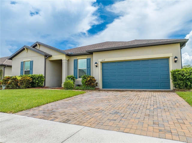 ranch-style home with a front lawn and a garage