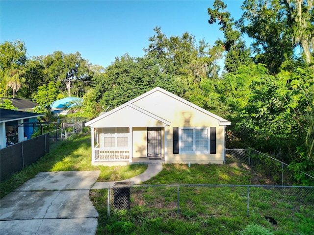 bungalow-style house featuring a front yard