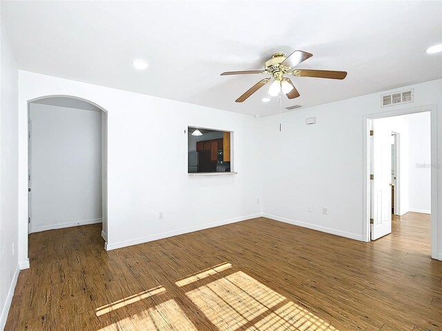 empty room with wood-type flooring and ceiling fan