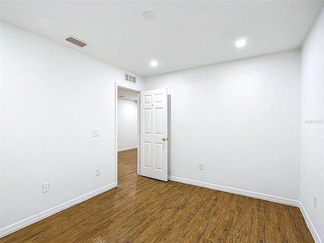 spare room featuring hardwood / wood-style flooring