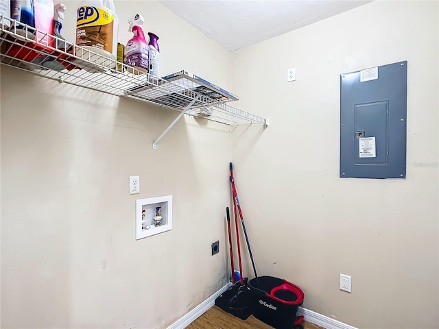 washroom featuring electric panel, wood-type flooring, electric dryer hookup, and hookup for a washing machine