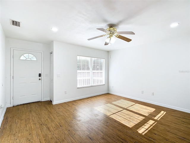 foyer with hardwood / wood-style flooring, a wealth of natural light, and ceiling fan